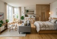 Stylish studio apartment interior with separate living and sleeping areas, modern furniture, natural light, and cozy Scandinavian-inspired décor.